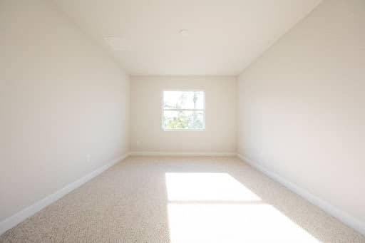 vacant real estate listing photo, virtually stage it as a living room or bedroom